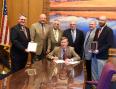 Colorado AuxComm Bill Signing (2016).jpg